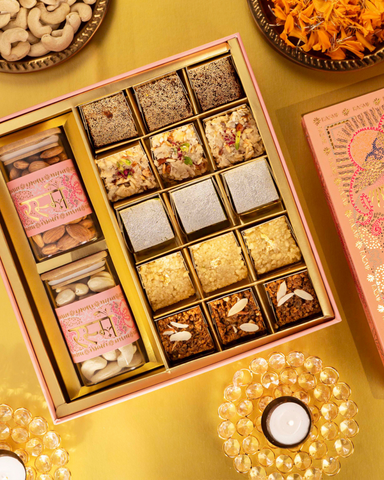 Pink celebration box with mithai and dry fruits
