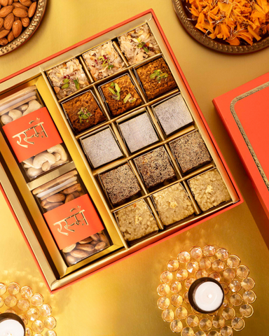 Orange box with mithai and dry fruits
